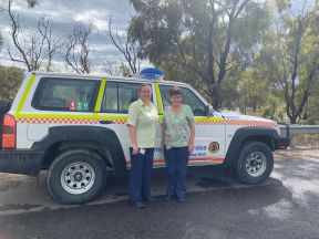 Andrea and Sandra standing next to rescue vehicle