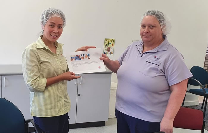 Left to right: Julie Bartolo being presented with her recognition in the Moment certificate by Nicole Sharpe, Site Supervisor Food Services, Macquarie Hospital